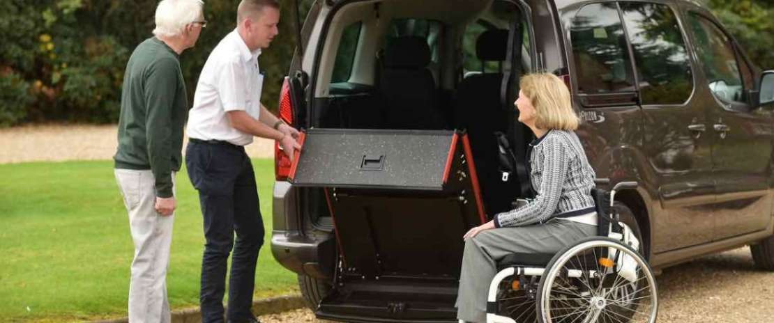 Wheelchair Accessible Vehicle ramp for a wheelchair user.jpg