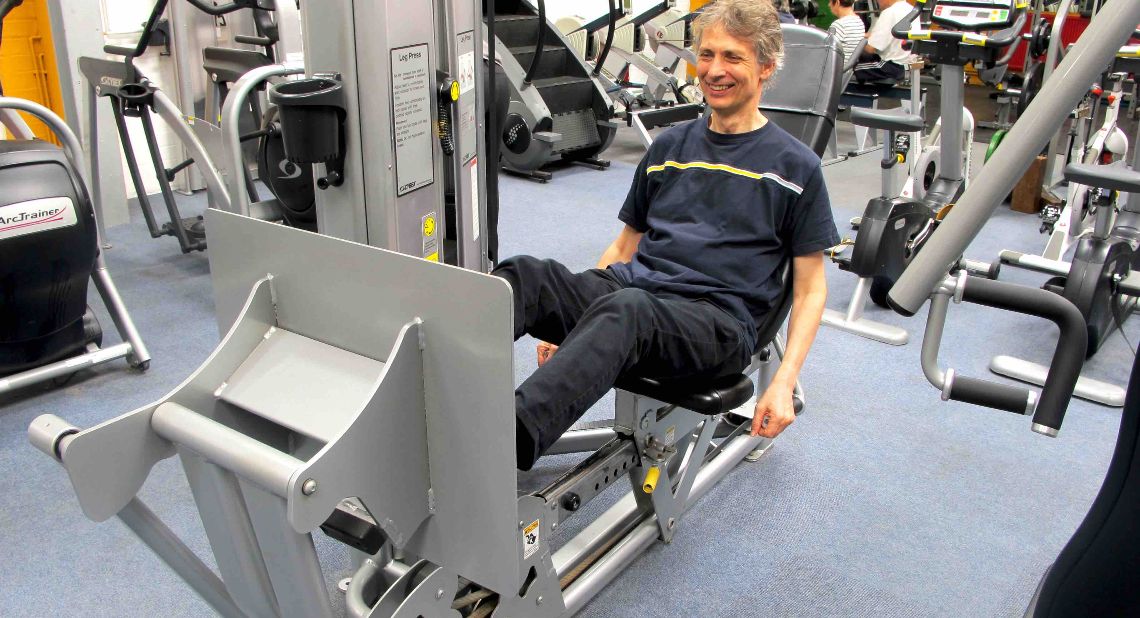 Ian exercising accessible gym equipment.jpg