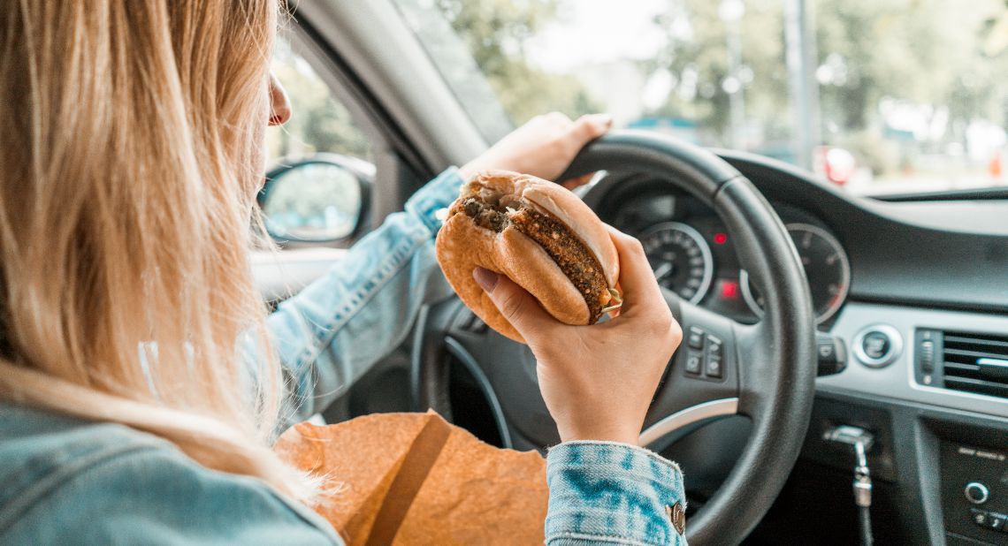 Woman eating whilst driving