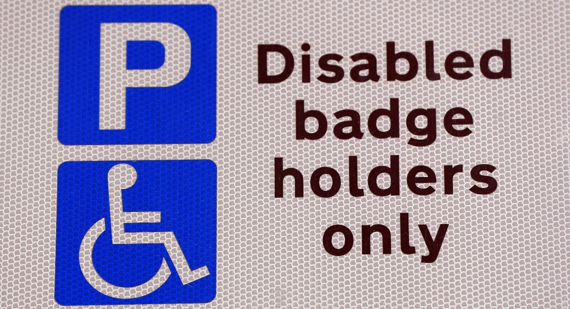 Disabled badge holders only sign familiar to blue badge holders and other drivers