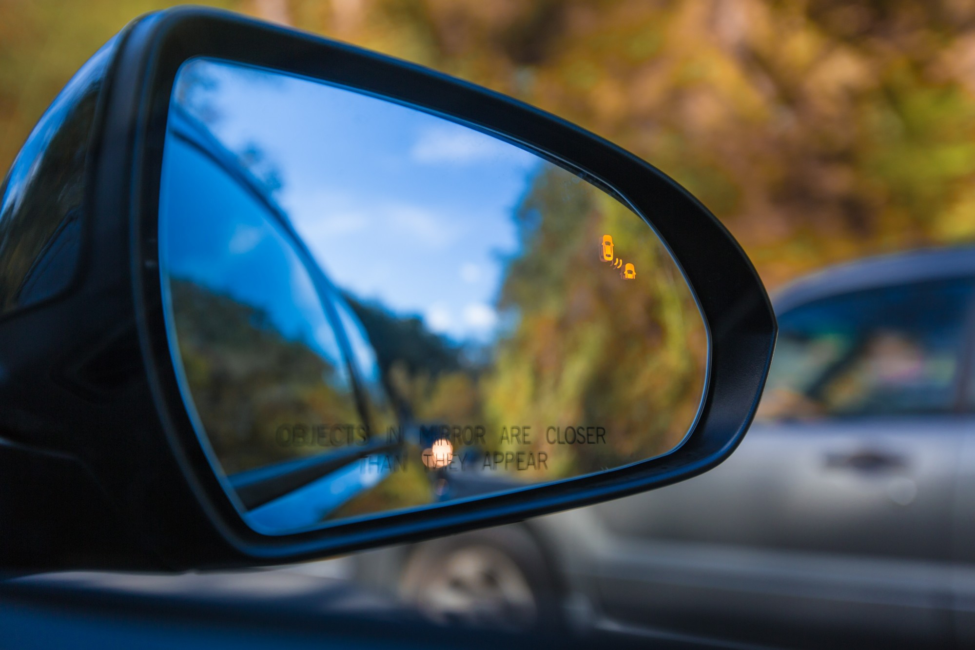 Objects in mirror are closer than they appear on car with Blind Spot Assist Warning LED Sensor Light