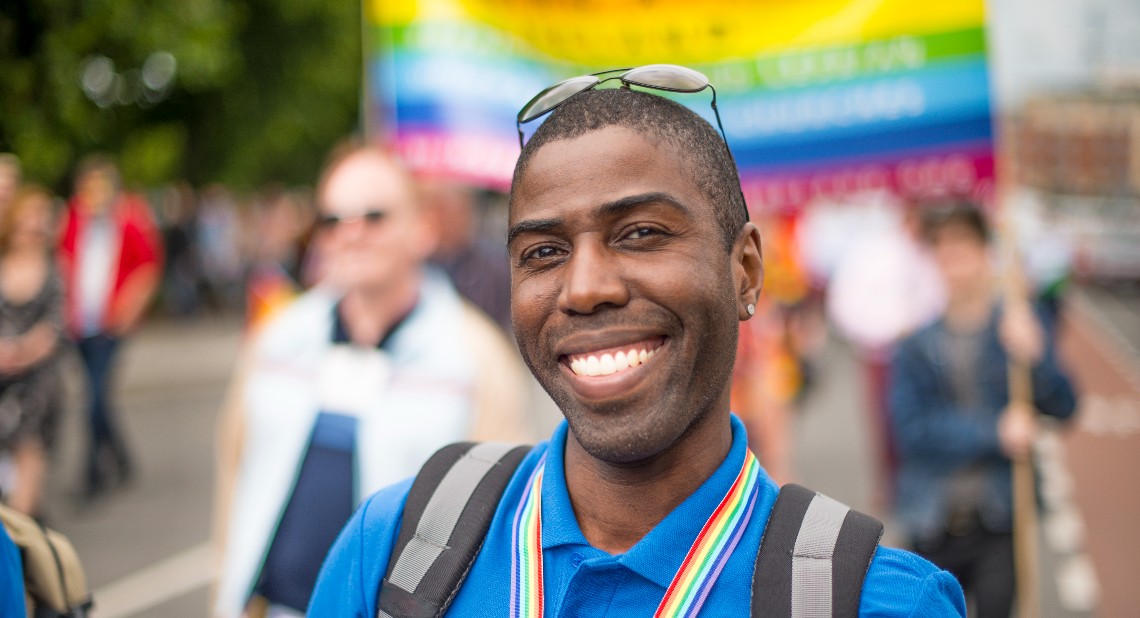 Smiling handsome gay man during Gay Pride Parade, Dublin, Ireland