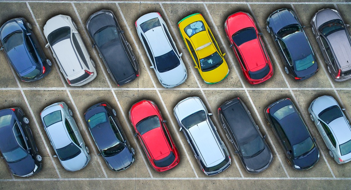 Aerial view of cars in a parking lot.