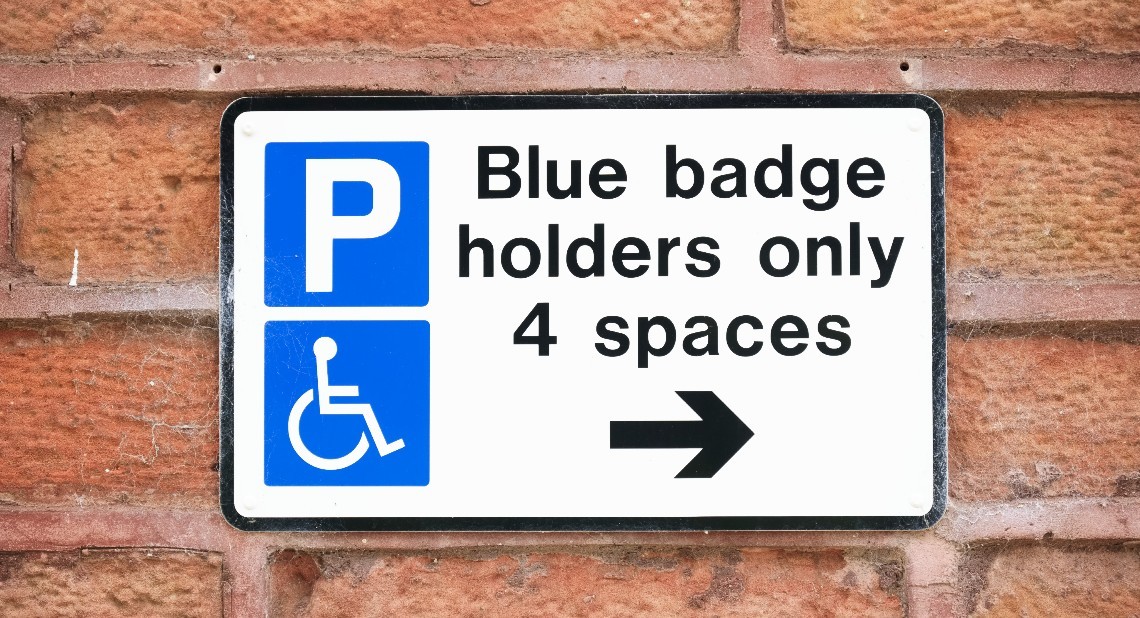 Disabled blue badge holder parking sign for driver UK