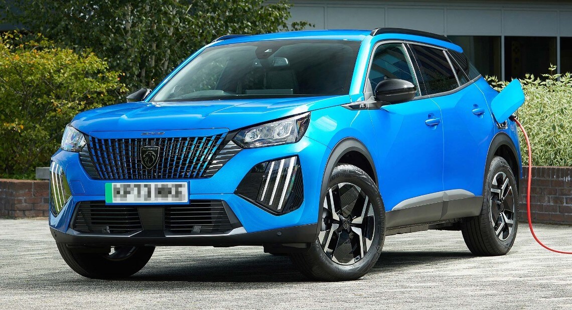 Bright blue Peugeot 2008 being parked being charged electrically