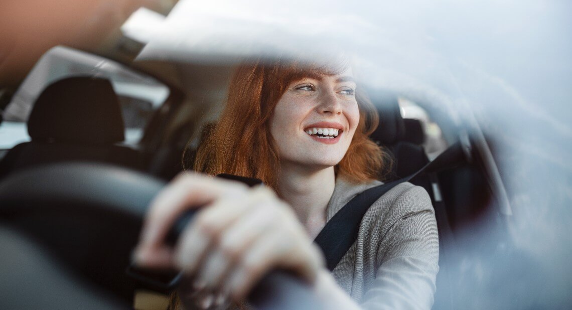 woman driving an electric car