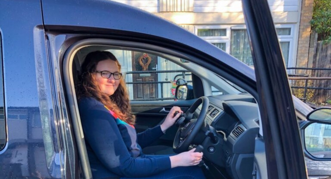 Writer Shona Louise inside her Wheelchair Accessible Vehicle (WAV) with the vehicle door open