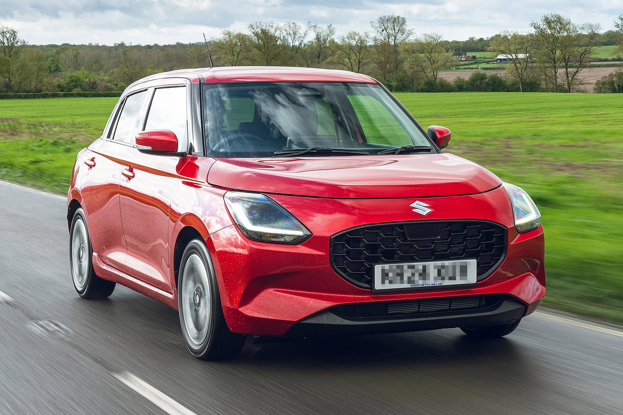 Red suzuki swift car