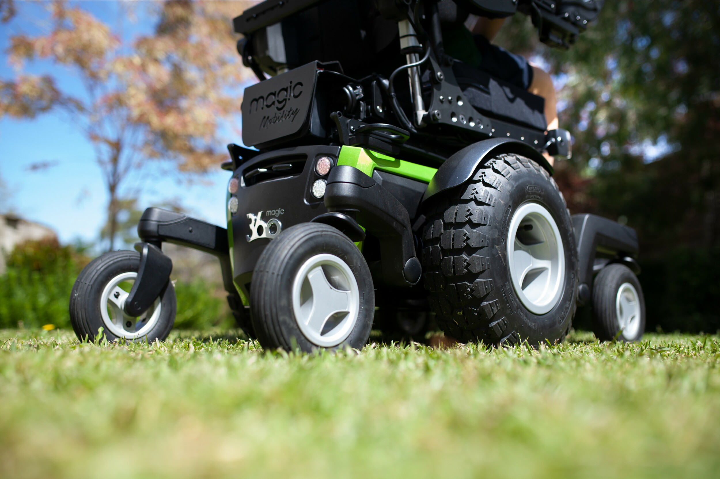 An image of the wheels of the Sunrise Medical Magic 360 crossing green grass