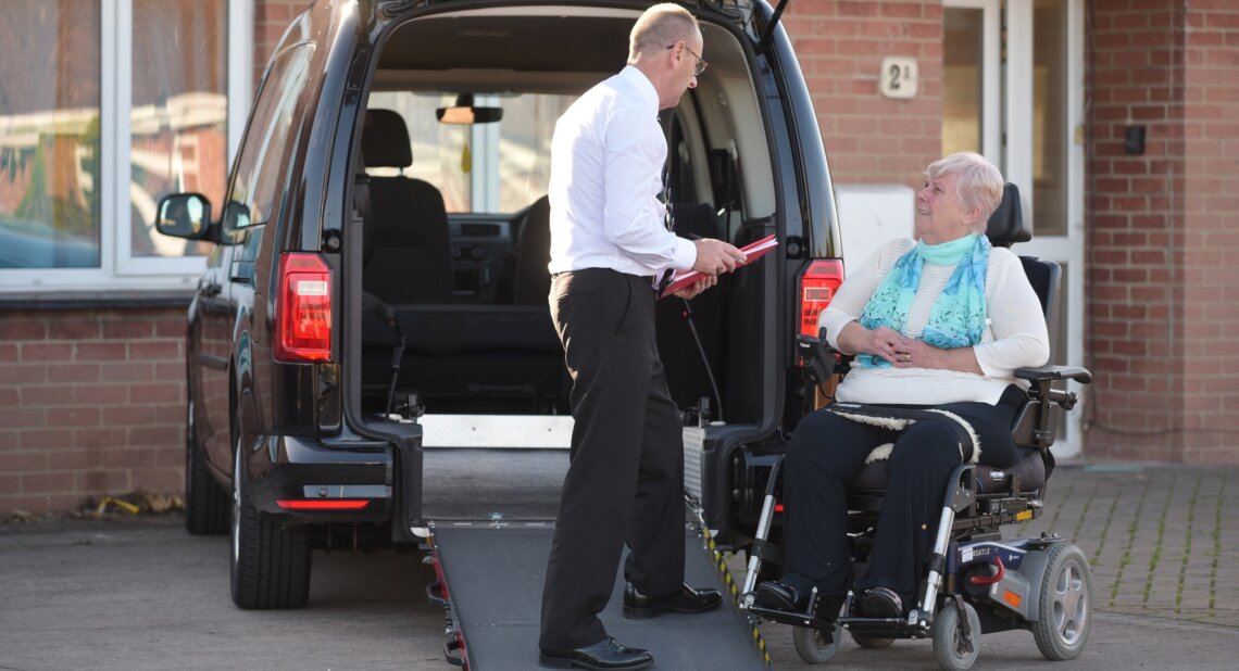 Woman talking to dealer about wheelchair accessible vehicle