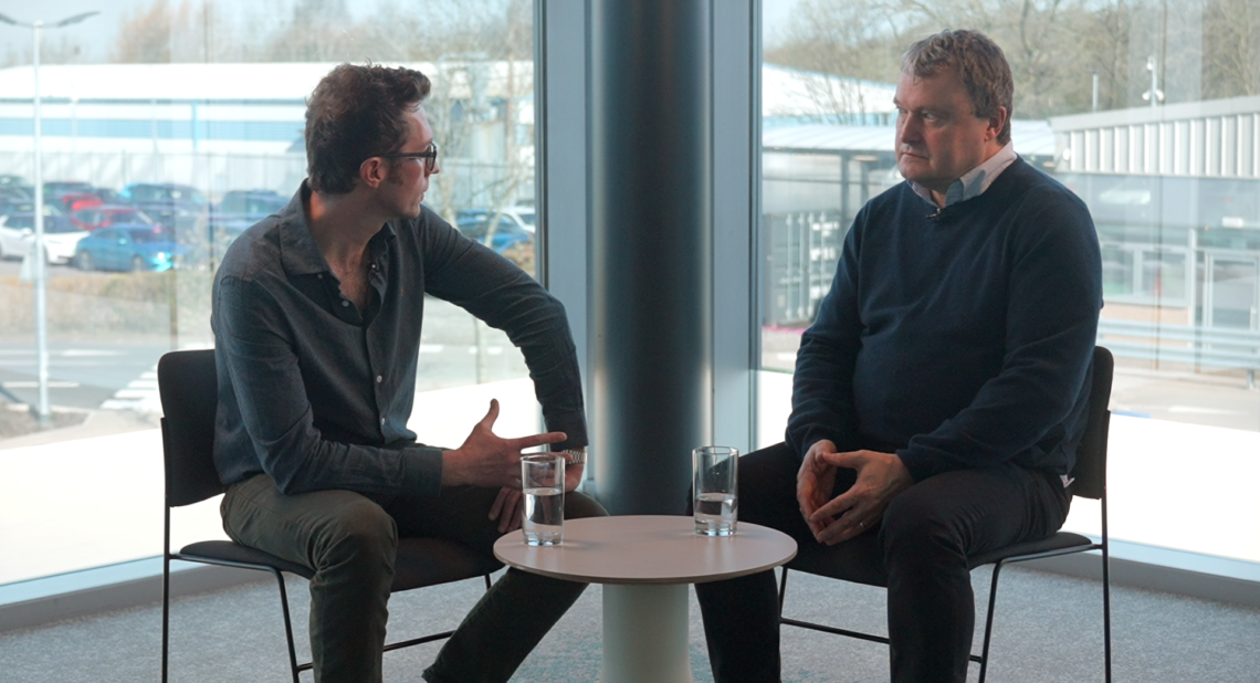 2 men sat down facing each other for a interview