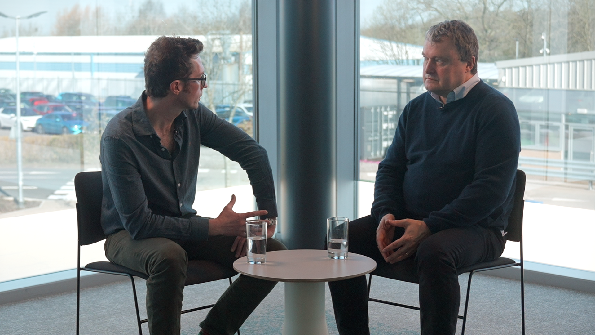 2 men sat down facing each other for a interview